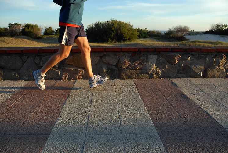 Legs of a young man running